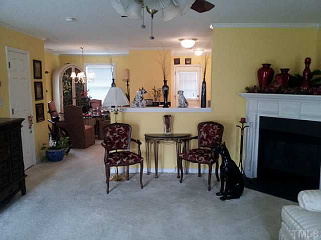 2052 Buffalo Way Durham, NC 27704 - Photo 3 of 20 a living room with fireplace furniture and a large window