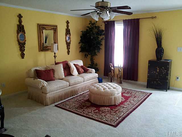 2052 Buffalo Way Durham, NC 27704 - Photo 4 of 20 a living room with furniture and a window