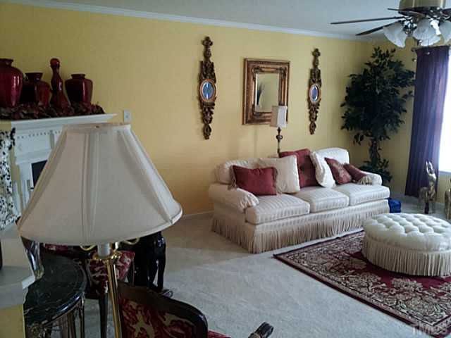 2052 Buffalo Way Durham, NC 27704 - Photo 5 of 20 a living room with furniture and flowers