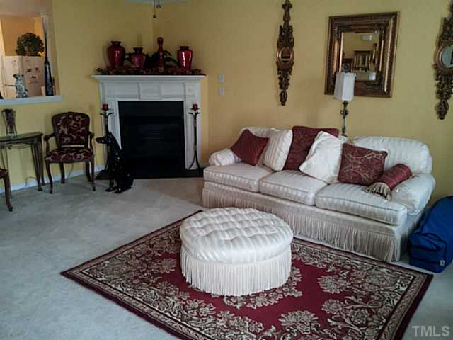 2052 Buffalo Way Durham, NC 27704 - Photo 7 of 20 a living room with furniture and a fireplace