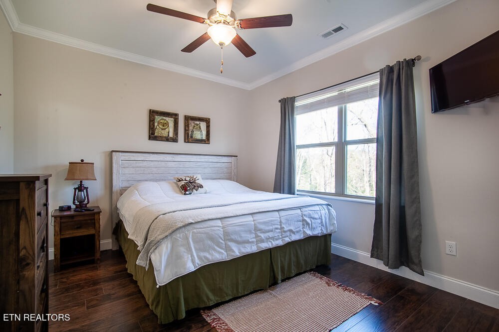 338 Shooting Star Loop, Unit 203 Townsend, TN 37882 - Photo 17 of 30 a bedroom with a large bed and a window