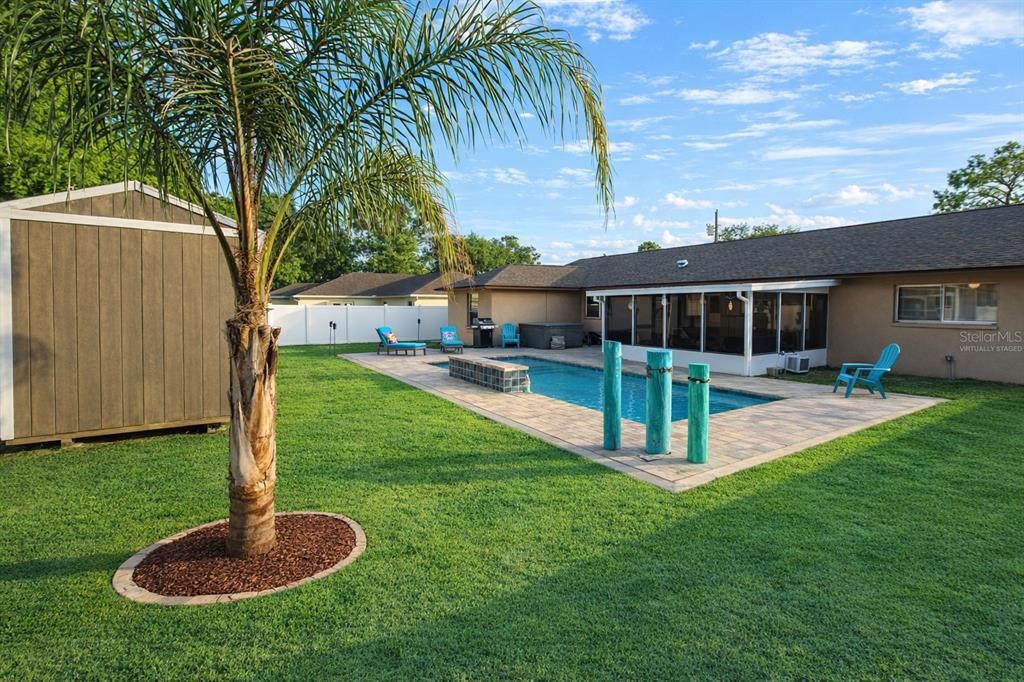 5046 Kenmore Street Spring Hill, FL 34608 - Photo 15 of 19 a view of a house with a yard deck and a slide