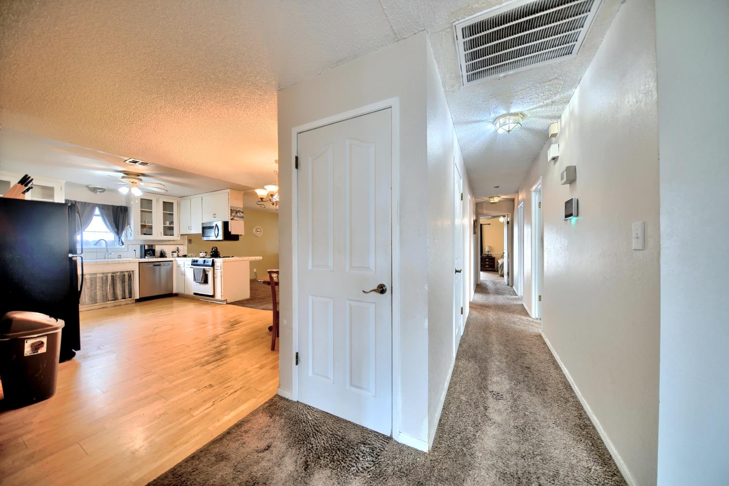 6521 Narcisco Way Hughson, CA 95326 - Photo 11 of 40 a view of a kitchen and dining room