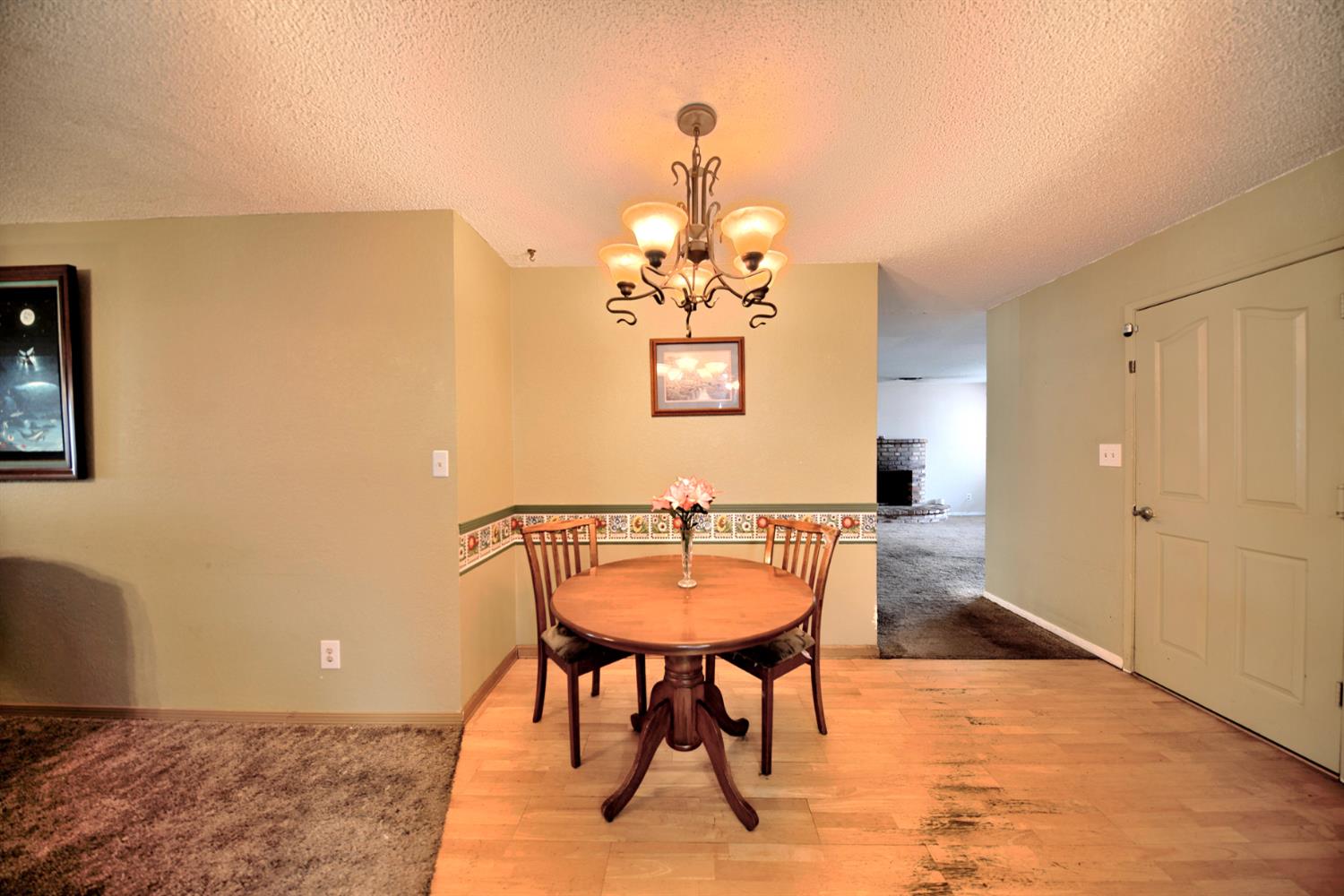 6521 Narcisco Way Hughson, CA 95326 - Photo 15 of 40 a view of a dining room with furniture and wooden floor