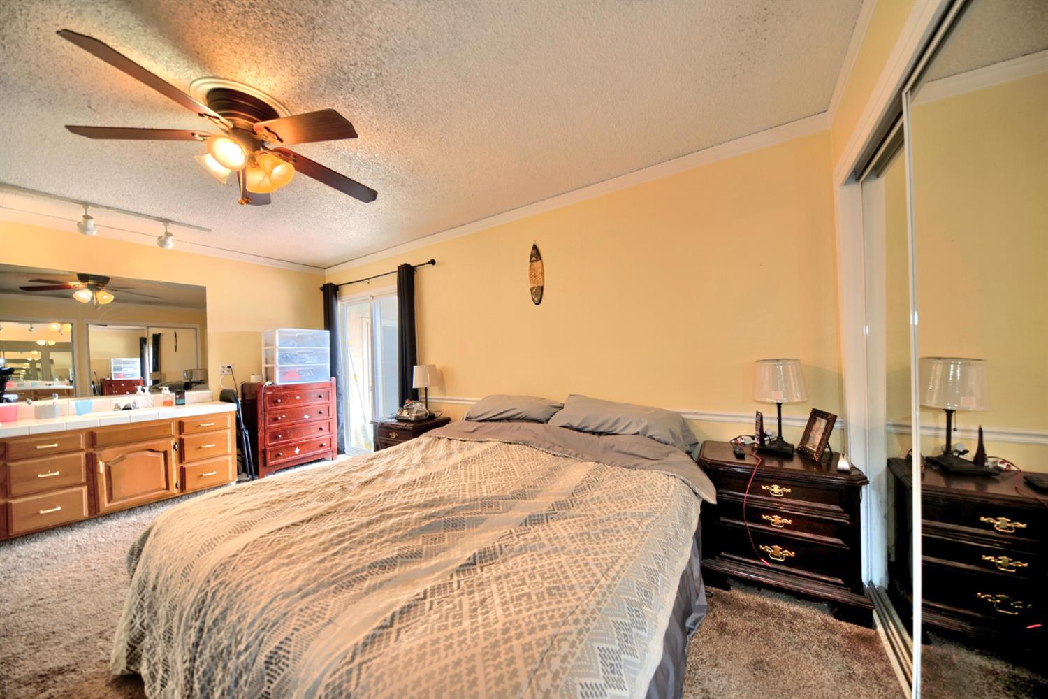 6521 Narcisco Way Hughson, CA 95326 - Photo 26 of 40 a bed room with a bed and dresser