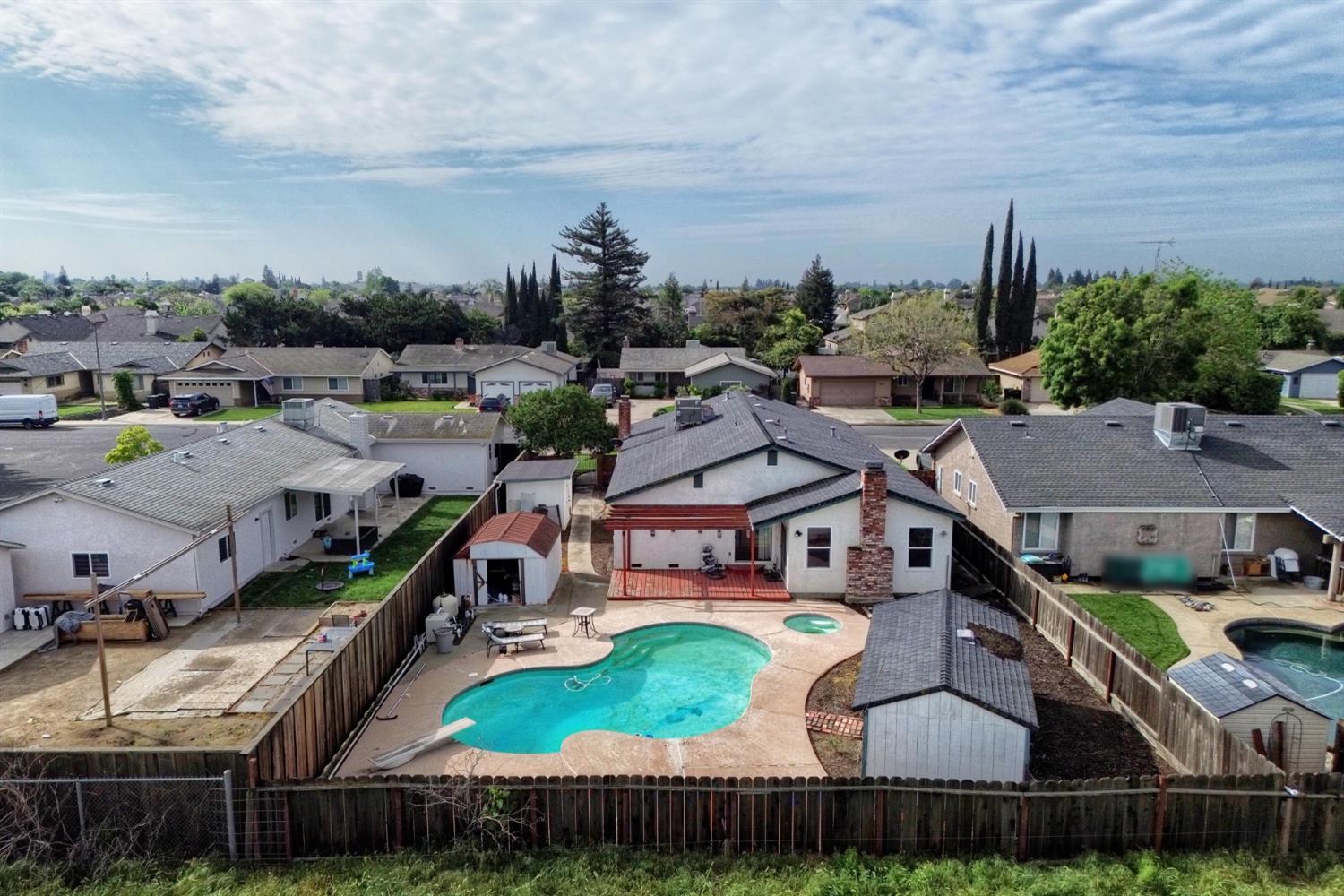 6521 Narcisco Way Hughson, CA 95326 - Photo 39 of 40 an aerial view of a house with garden space and street view