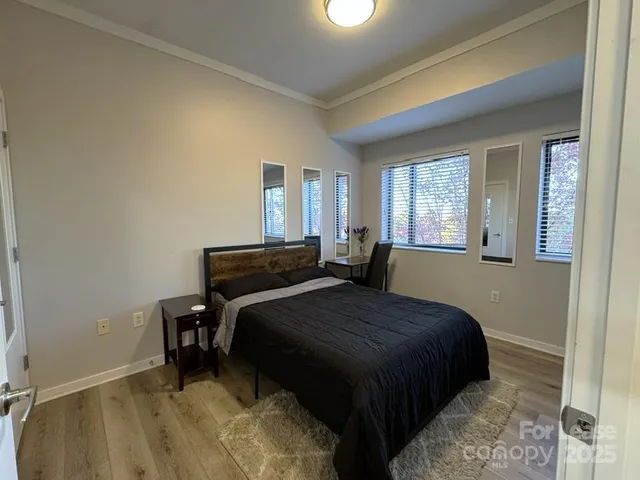 a bedroom with a bed and a table