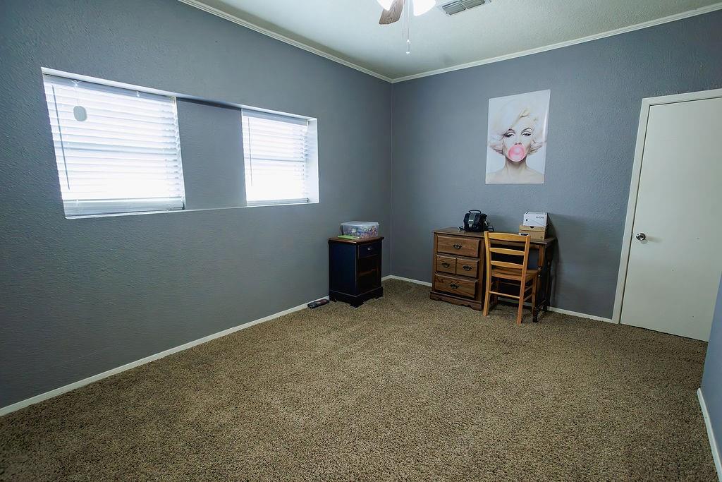 1308 West 14th Street Cisco, TX 76437 - Photo 18 of 39 a furnished livingroom with a window
