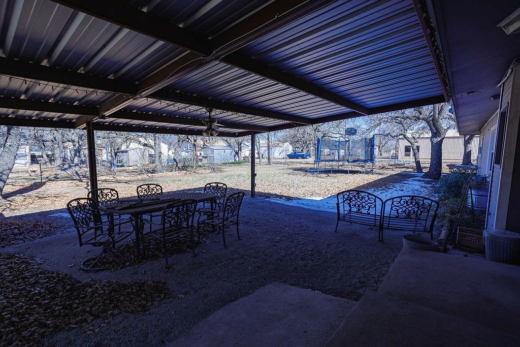 1308 West 14th Street Cisco, TX 76437 - Photo 25 of 39 a view of a backyard with sitting area