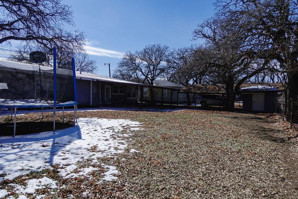 1308 West 14th Street Cisco, TX 76437 - Photo 36 of 39 a view of a yard with a tree
