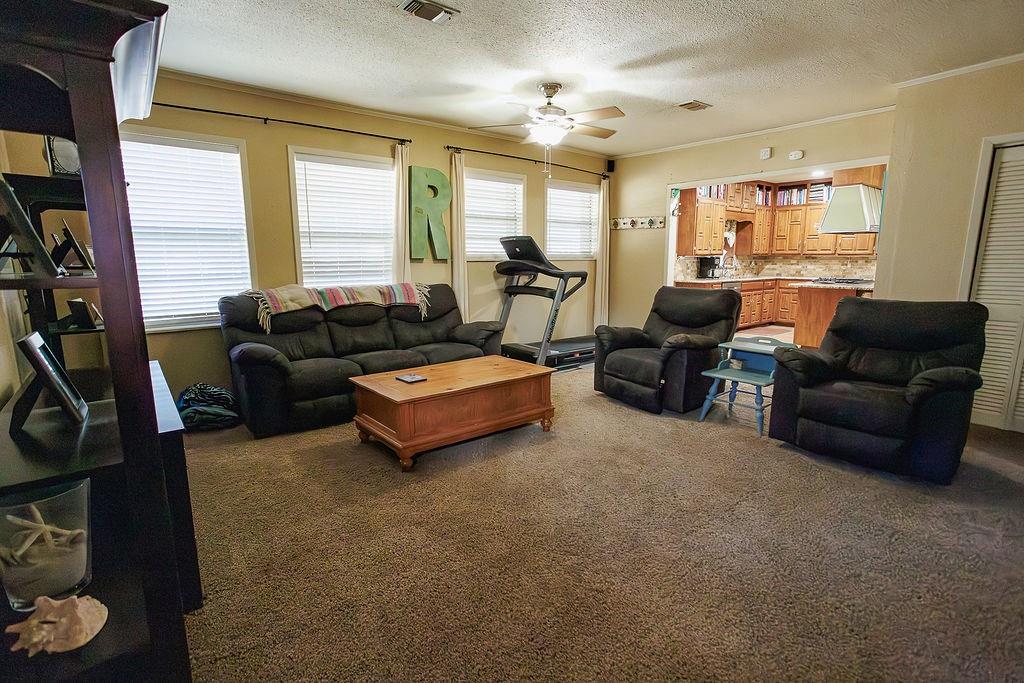 1308 West 14th Street Cisco, TX 76437 - Photo 9 of 39 a living room with furniture and a large window
