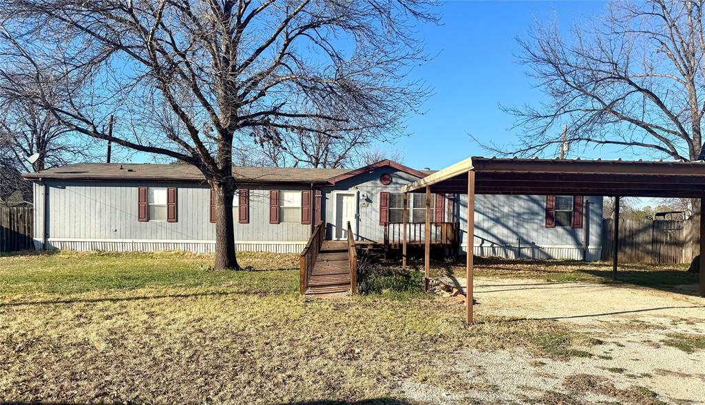 a view of a house with a yard patio and deck
