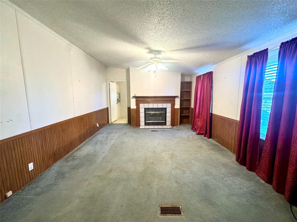 211 West F Street Munday, TX 76371 - Photo 17 of 27 a view of an empty room with a window