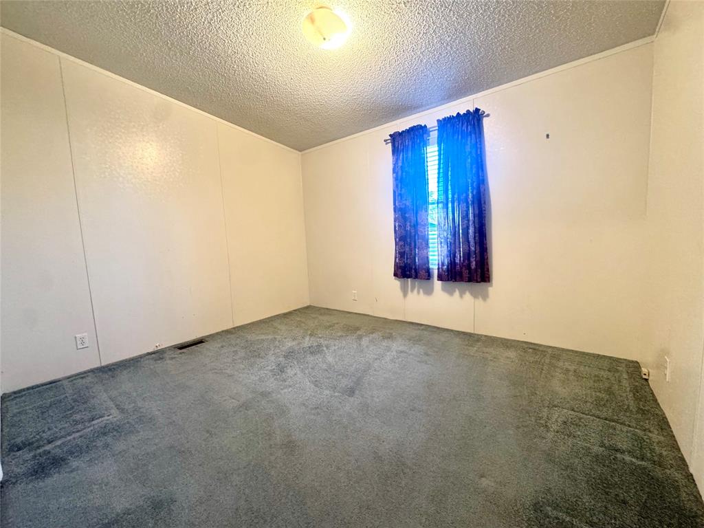 211 West F Street Munday, TX 76371 - Photo 20 of 27 a view of an empty room