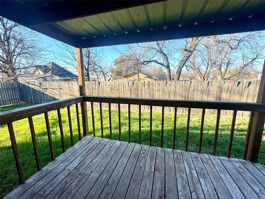 211 West F Street Munday, TX 76371 - Photo 23 of 27 a view of balcony with wooden floor