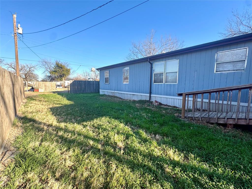 211 West F Street Munday, TX 76371 - Photo 24 of 27 a view of a backyard with plants