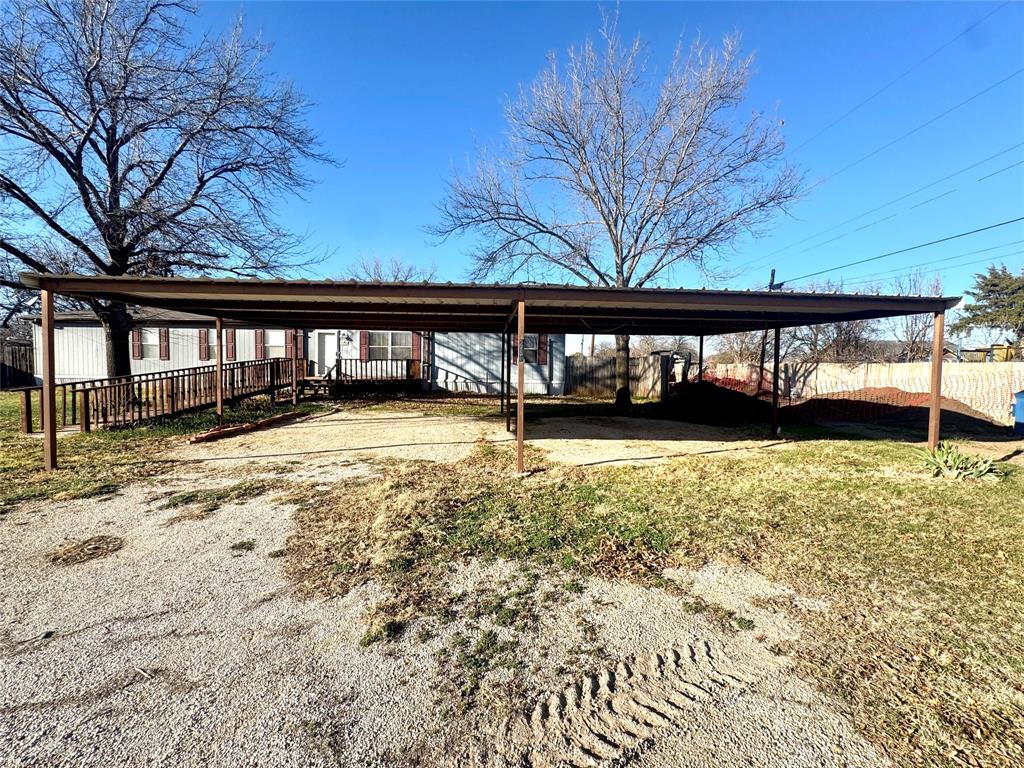211 West F Street Munday, TX 76371 - Photo 27 of 27 a view of a house with a yard