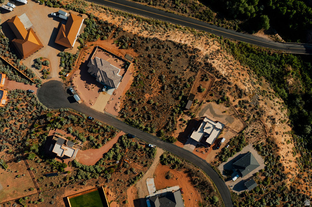 50 Dry Gulch Road, Unit 50 Kanab, UT 84741 - Photo 12 of 20 Residential area featuring multiple properties, winding paved roads, and natural, arid landscaping