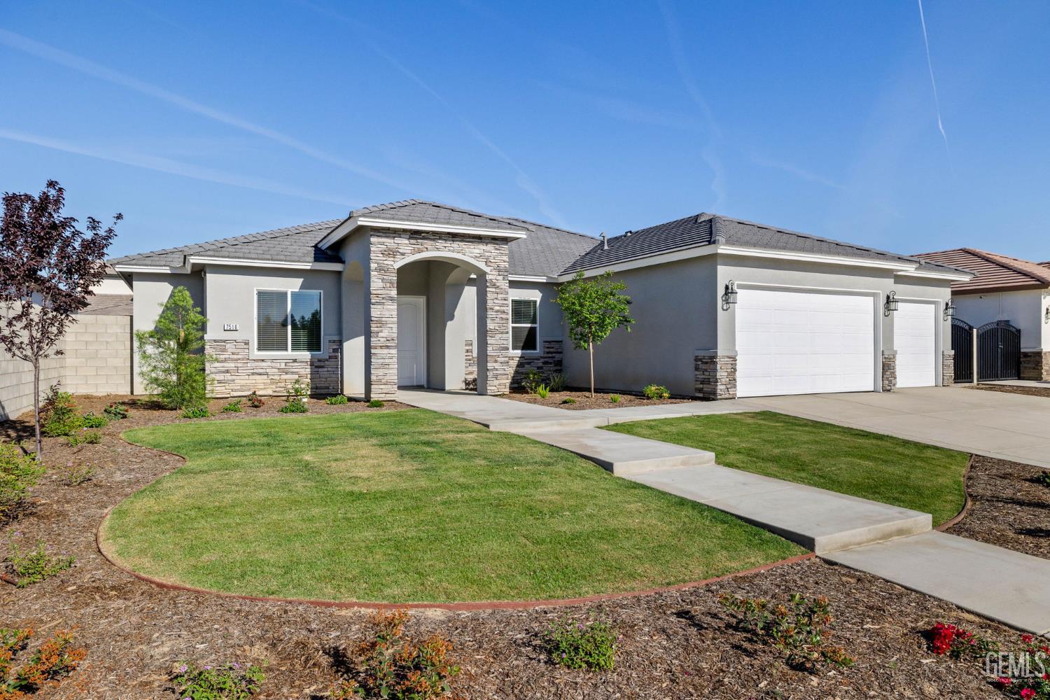 Undisclosed Address Bakersfield, CA 93314 - Photo 6 of 55 a front view of a house with a yard