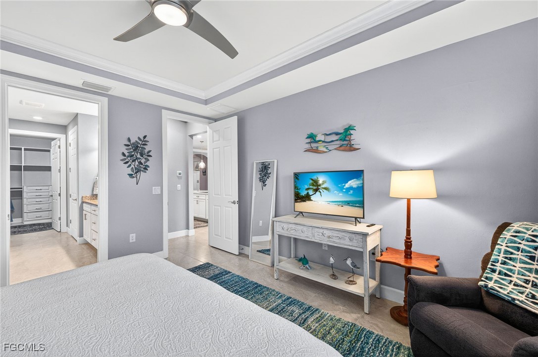 1506 Hyssop Loop North Port, FL 34289 - Photo 12 of 32 a bedroom with furniture and a flat screen tv
