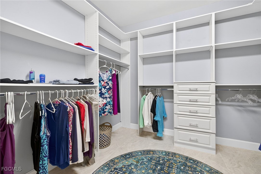 1506 Hyssop Loop North Port, FL 34289 - Photo 17 of 32 a view of walk in closet with clothes and shoes