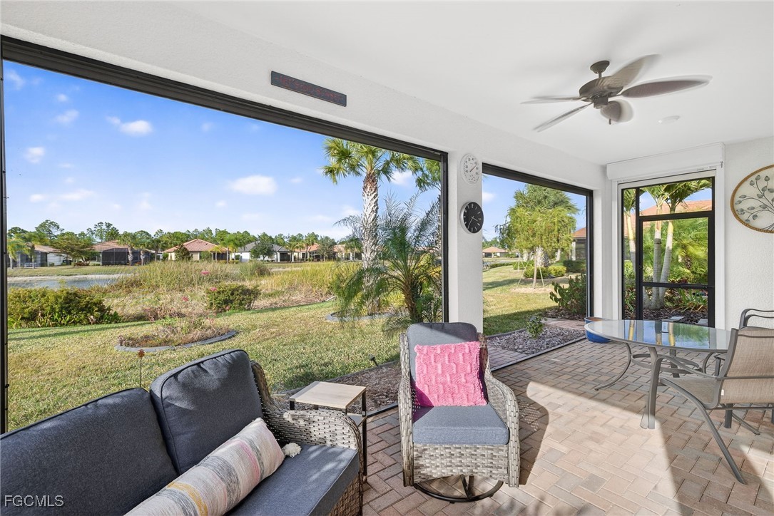 1506 Hyssop Loop North Port, FL 34289 - Photo 21 of 32 a living room with furniture floor to ceiling window and a floor to ceiling window
