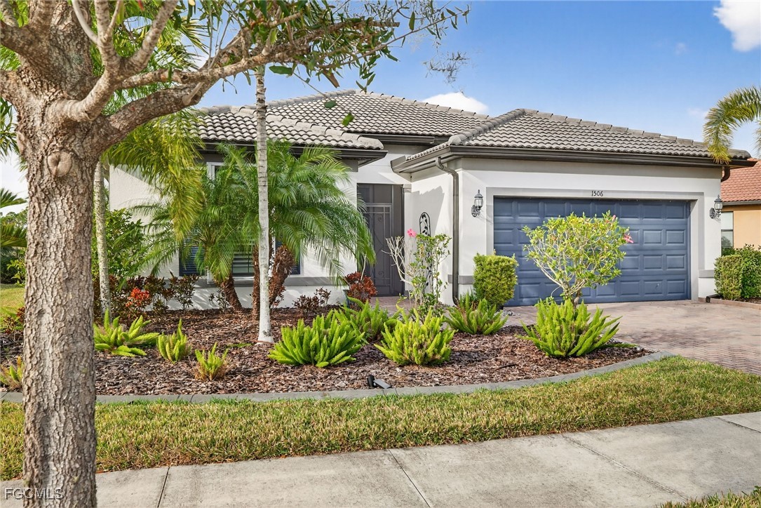 1506 Hyssop Loop North Port, FL 34289 - Photo 23 of 32 a front view of a house with garden