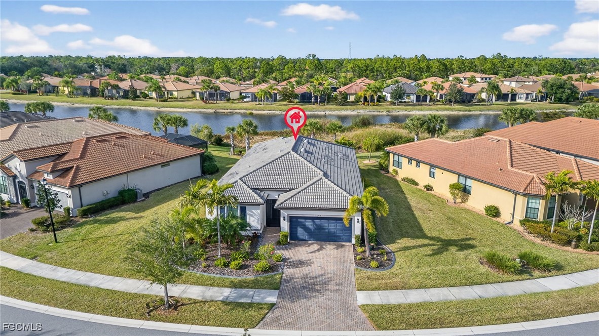 1506 Hyssop Loop North Port, FL 34289 - Photo 24 of 32 an aerial view of a house with a lake view