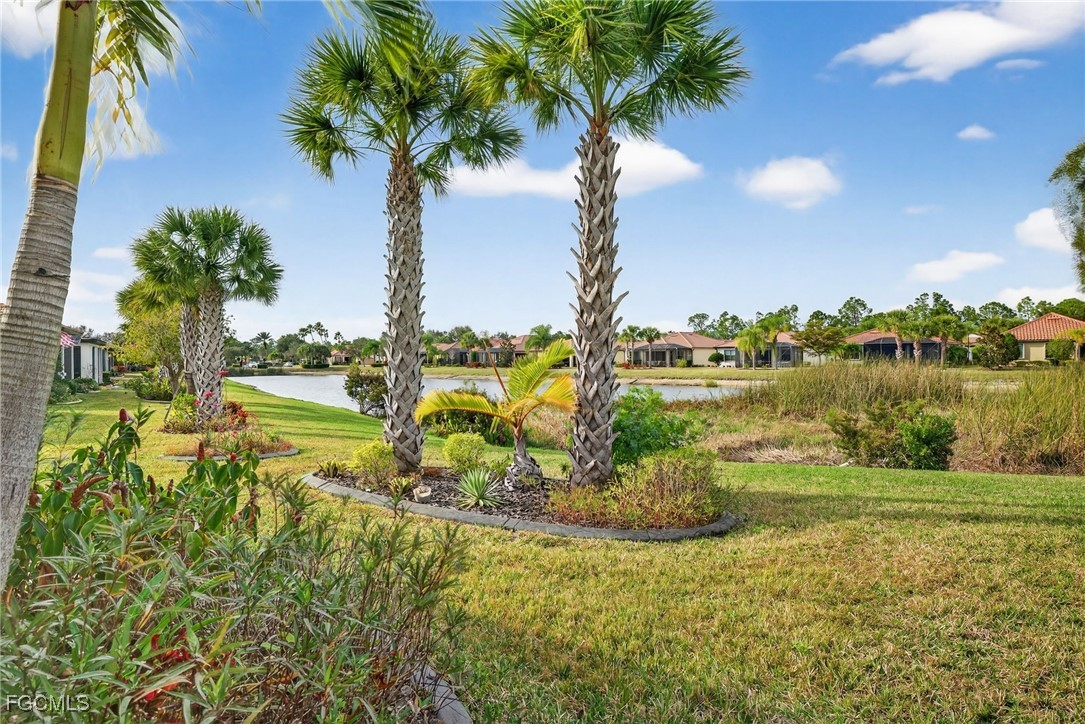 1506 Hyssop Loop North Port, FL 34289 - Photo 26 of 32 a view of a lake with a big yard