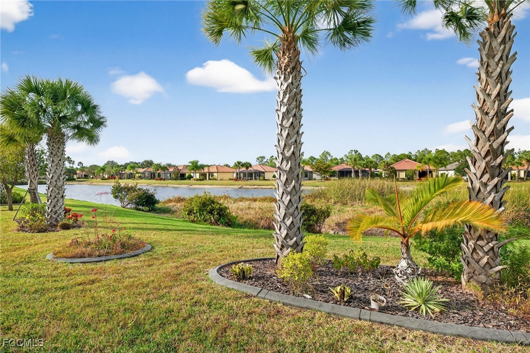 1506 Hyssop Loop North Port, FL 34289 - Photo 27 of 32 a view of a lake with a big yard