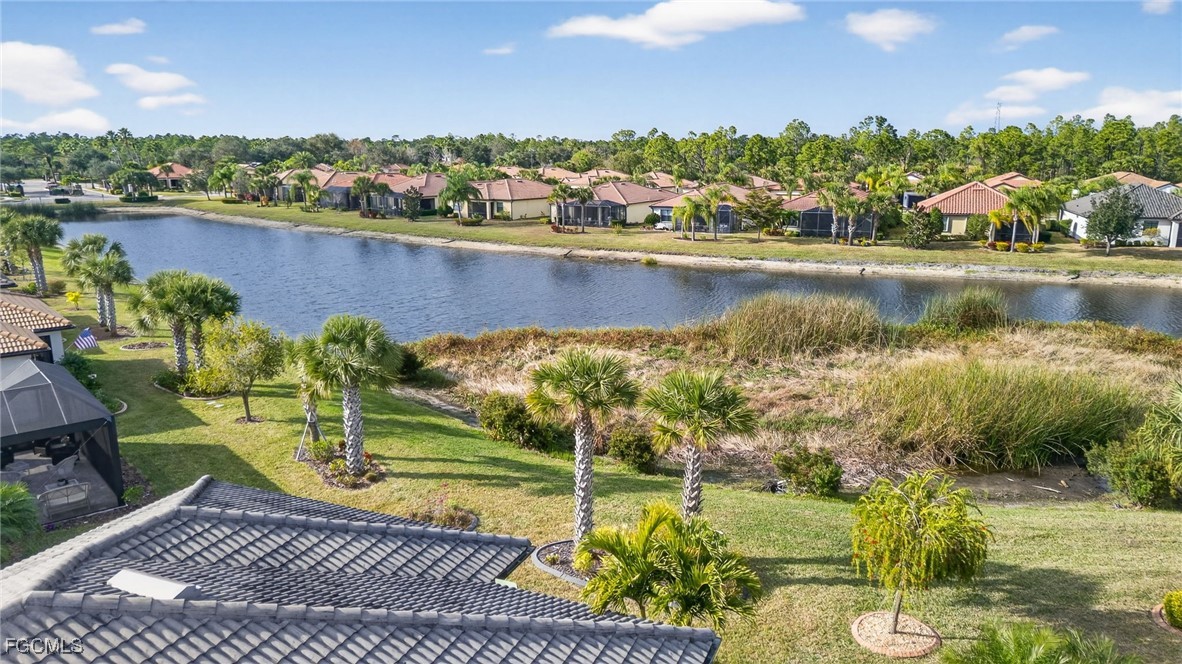 1506 Hyssop Loop North Port, FL 34289 - Photo 30 of 32 a view of a lake with houses in the back