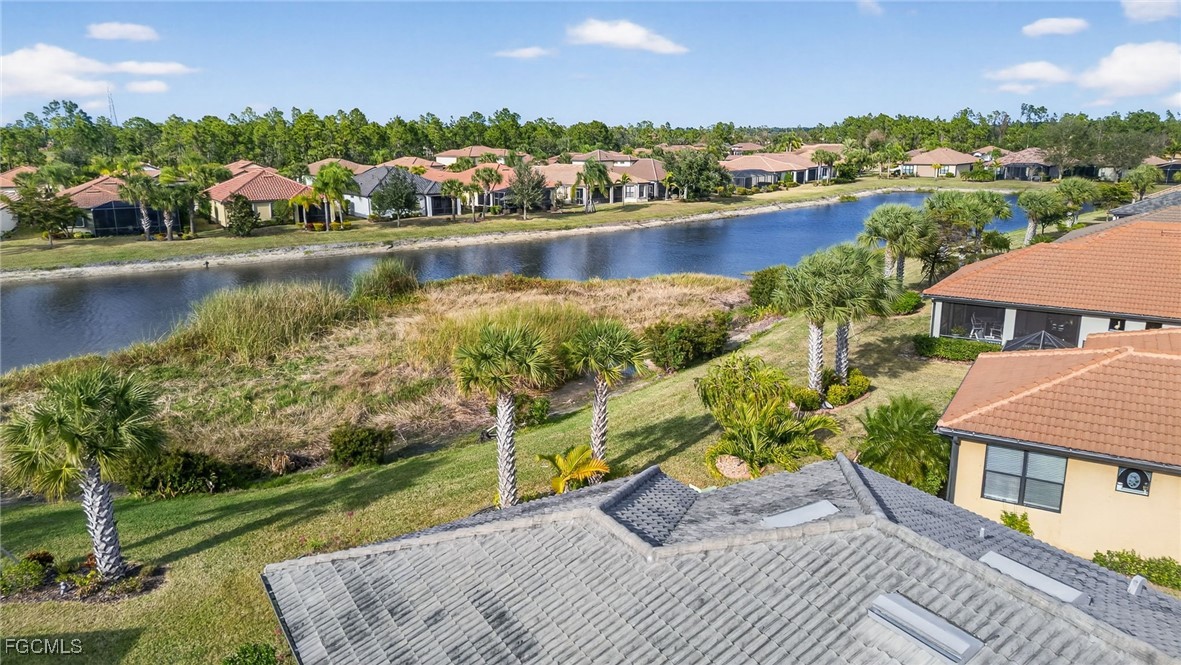 1506 Hyssop Loop North Port, FL 34289 - Photo 31 of 32 a view of a lake with a house in the background