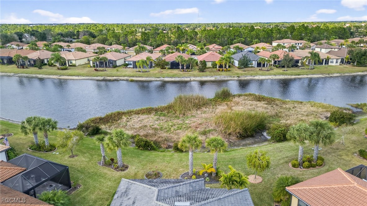 1506 Hyssop Loop North Port, FL 34289 - Photo 32 of 32 a view of a lake with a house