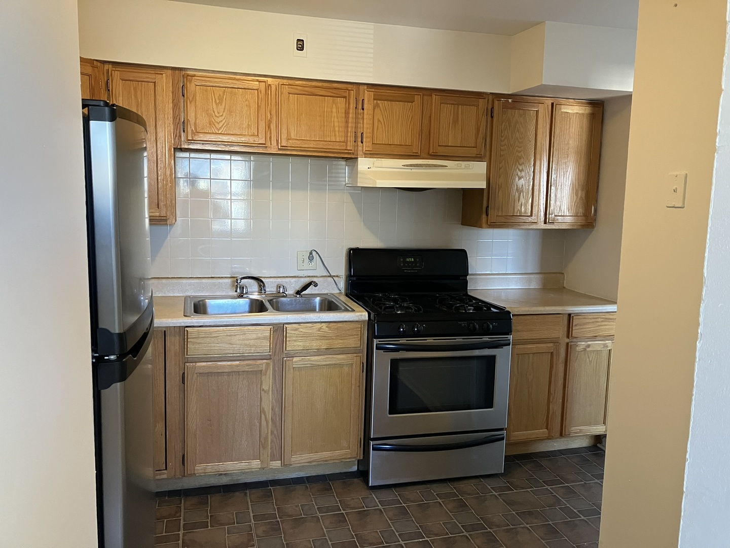 2404 East 79th Street Chicago, IL 60649 - Photo 8 of 22 a kitchen with a stove and a refrigerator