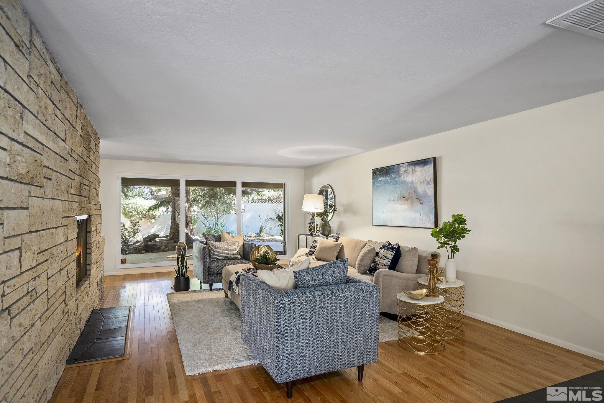 2080 Dant Boulevard Reno, NV 89509 - Photo 4 of 40 a living room with furniture and a wooden floor