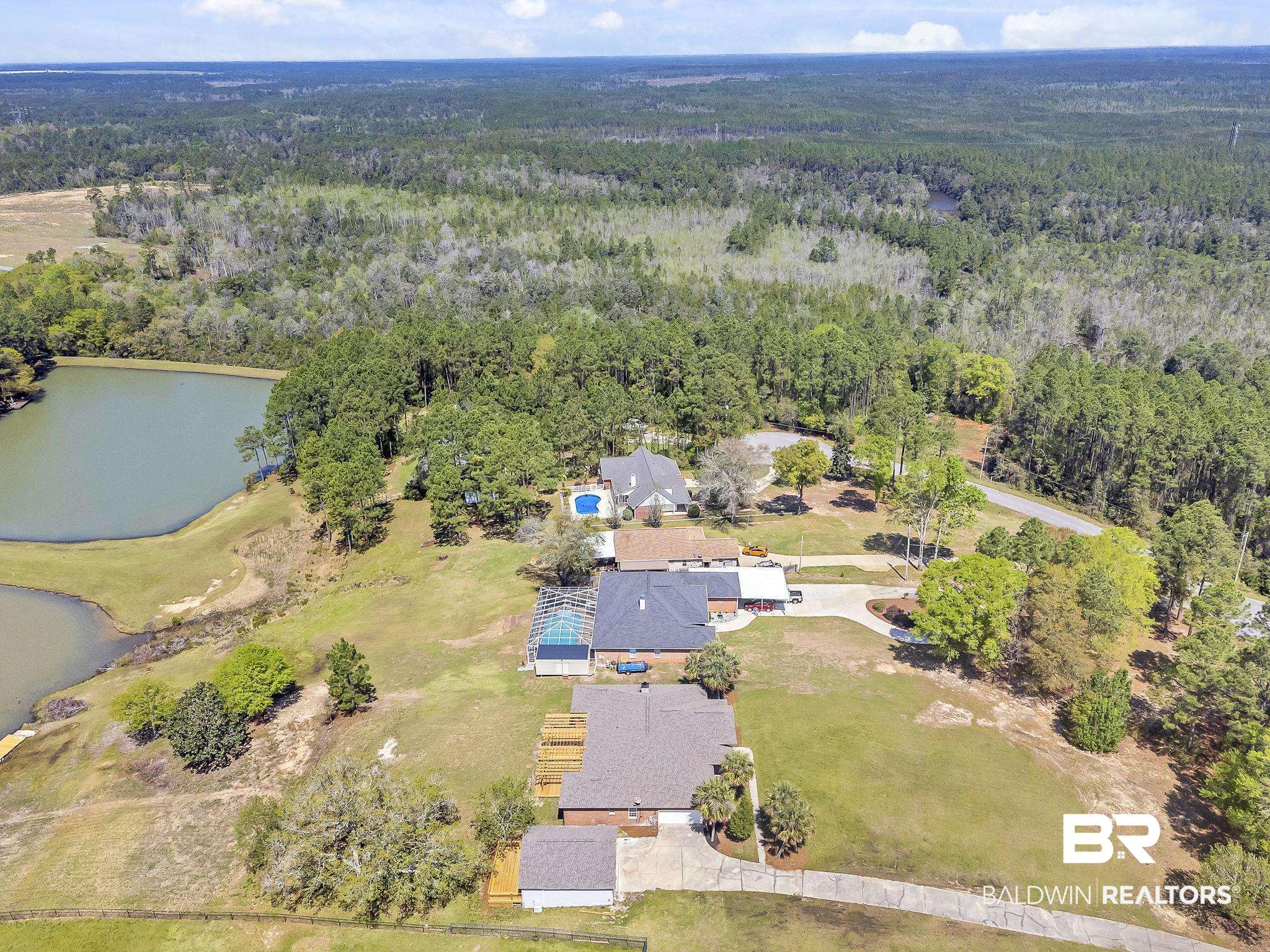 20265 Erin Pond Road Seminole, AL 36574 - Photo 63 of 97 Drone / aerial view featuring a water view and a wooded view