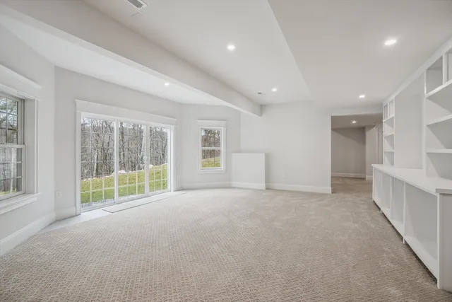 a view of an empty room with a sliding door