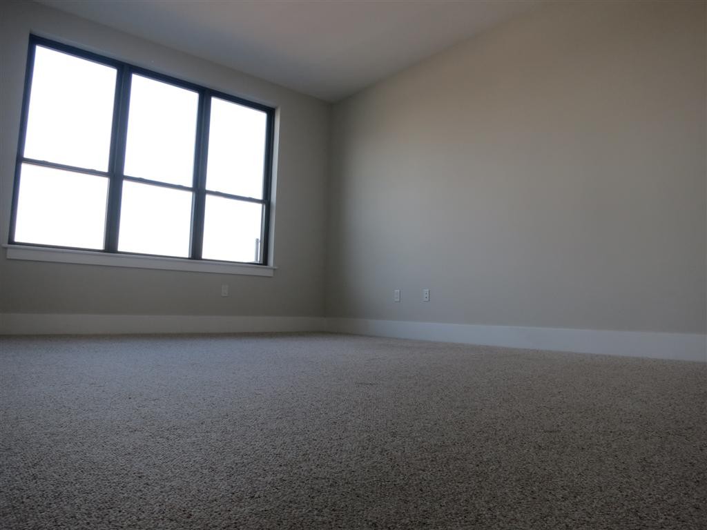154 West 2nd Street, Unit 401 Boston, MA 02127 - Photo 4 of 10 an empty room with a window
