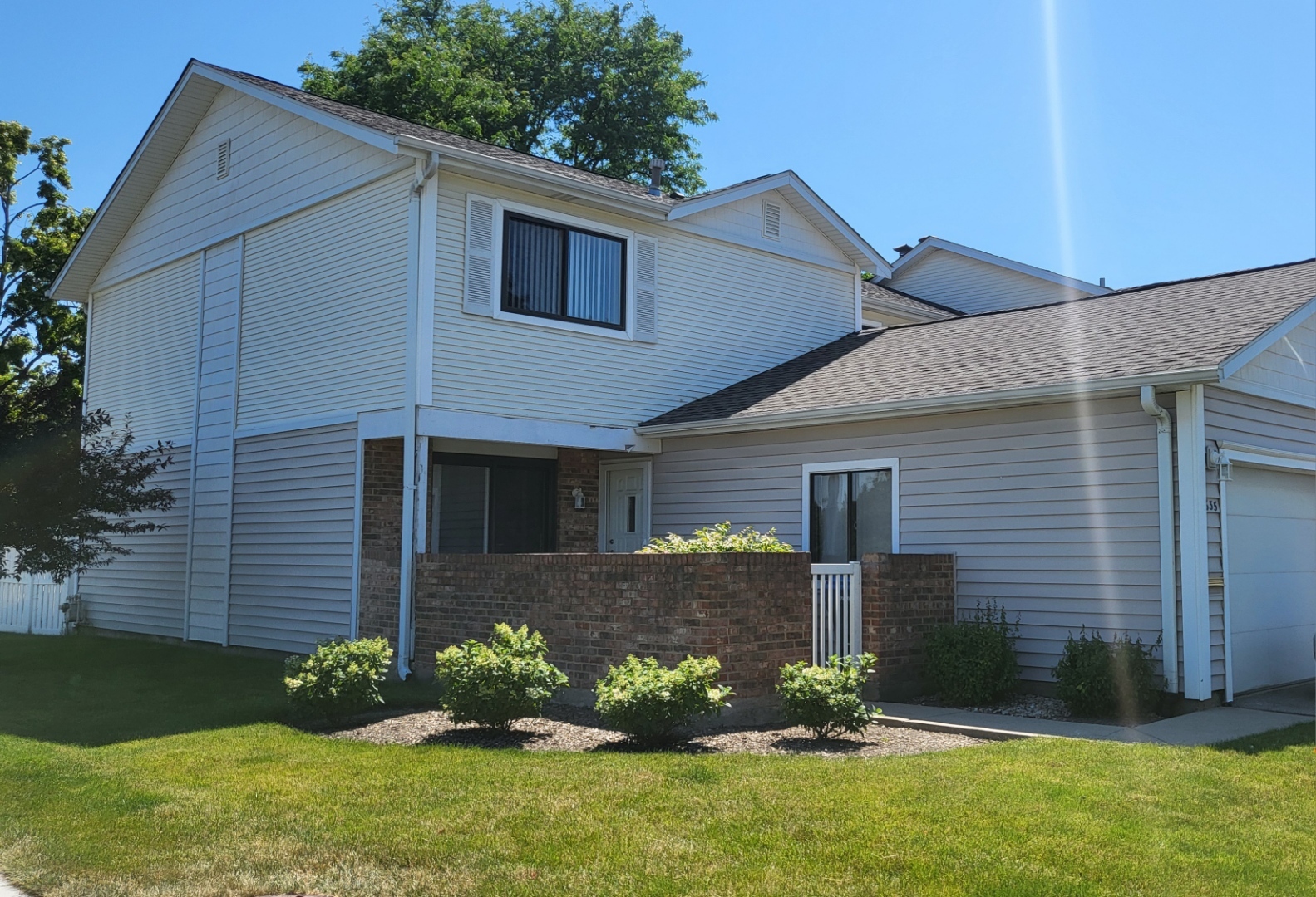 635 Breakers Point Schaumburg, IL 60194 - Photo 1 of 4 a front view of a house with garden