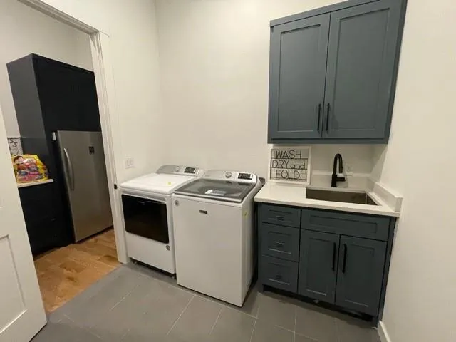 a living room with furniture a flat screen tv and a large window