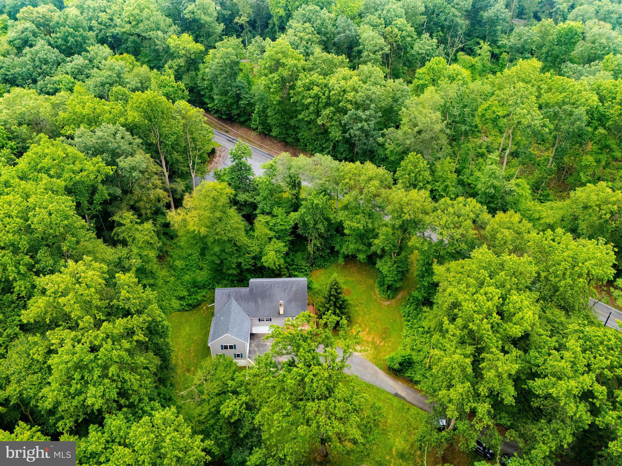 25 Red Hill Road Pequea, PA 17565 - Photo 8 of 52 an aerial view of residential house with outdoor space and trees all around