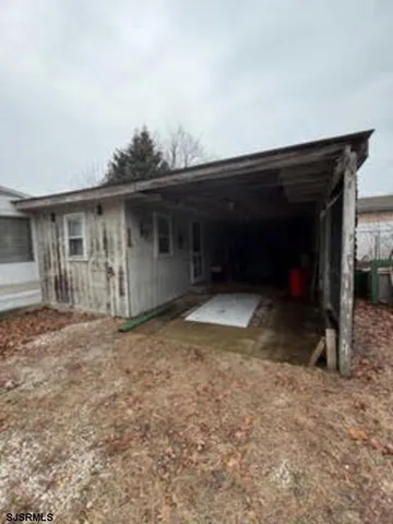 a view of a house with a yard and garage