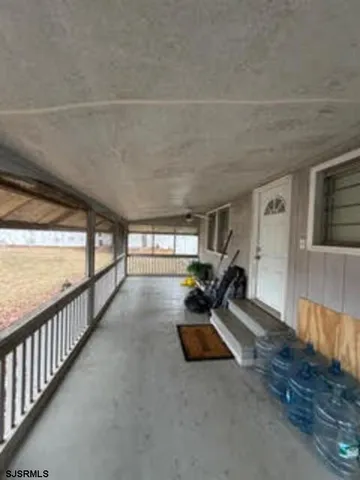 a view of an empty room and window