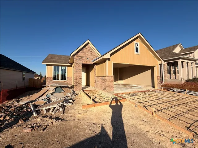 a view of a house with wooden floor and a flat screen tv