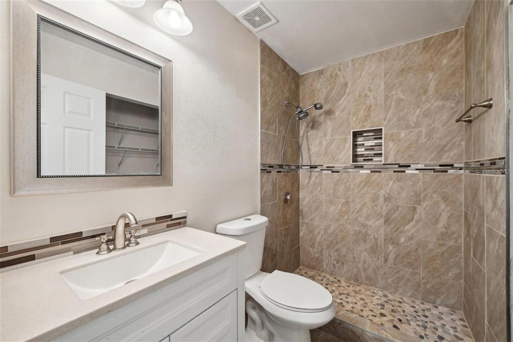5 Cedar Lane Ocala, FL 34472 - Photo 11 of 24 a bathroom with a sink toilet a mirror and shower