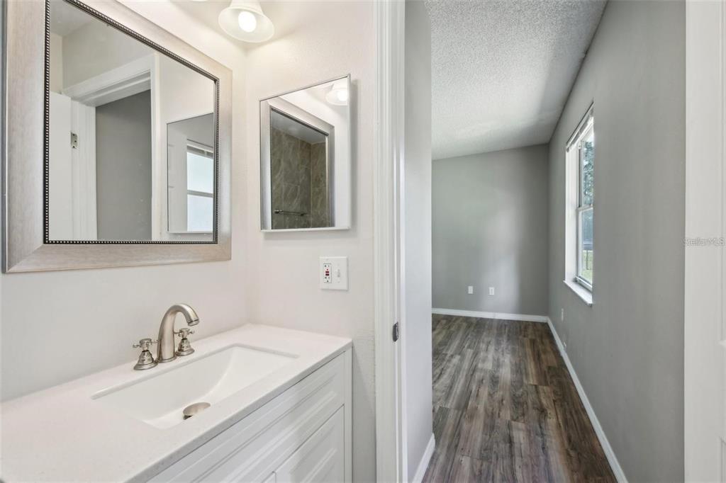 5 Cedar Lane Ocala, FL 34472 - Photo 14 of 24 a bathroom with a sink and a mirror