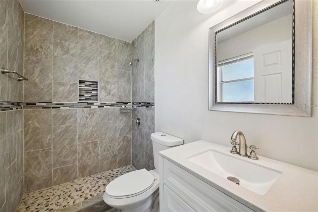 5 Cedar Lane Ocala, FL 34472 - Photo 15 of 24 a bathroom with a sink a toilet and shower