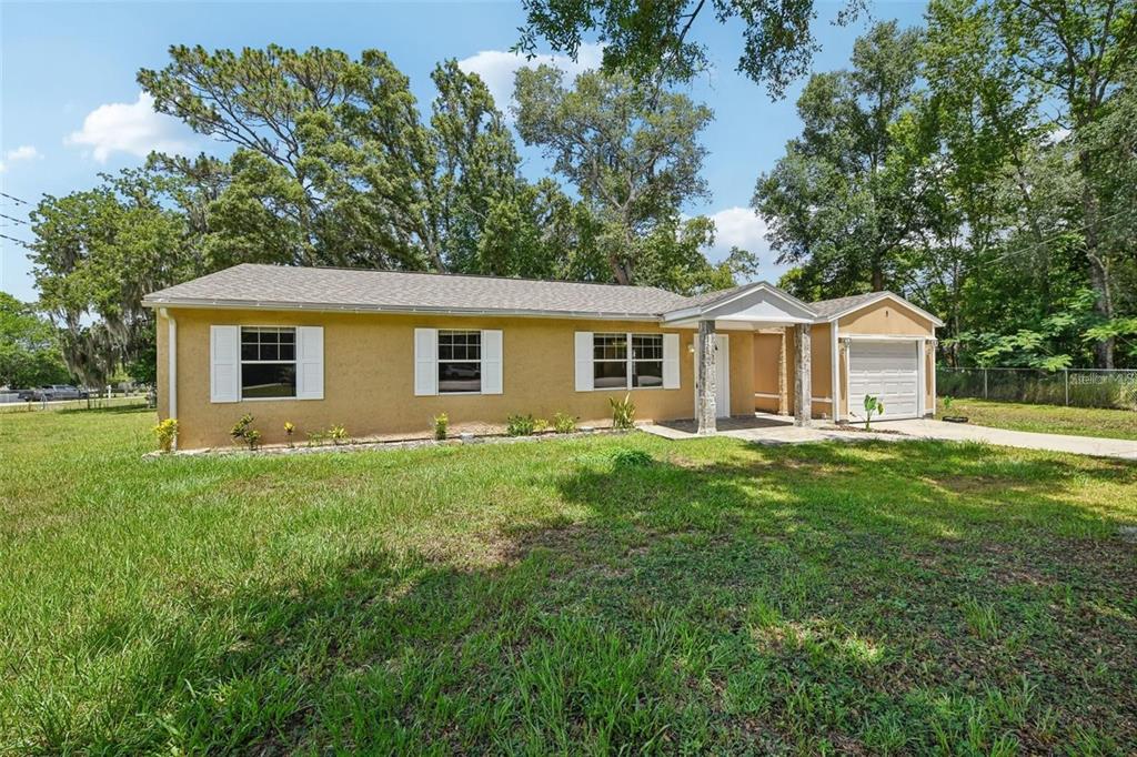 5 Cedar Lane Ocala, FL 34472 - Photo 3 of 24 a view of a house with a backyard