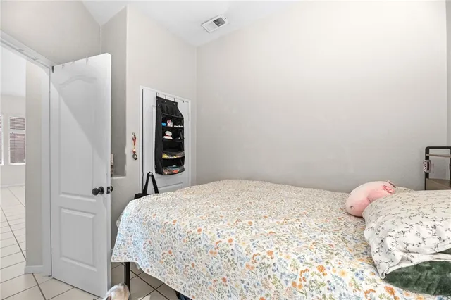 a bedroom with a bed and a closet