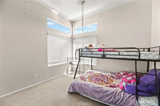 a bedroom with a bed and a bed